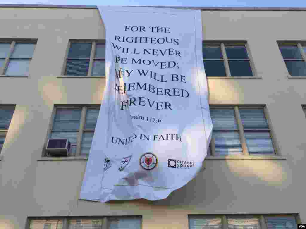 A banner at a building near the Emanuel AME Church, Charleston, South Carolina, June 20, 2015. (Amanda Scott/VOA)