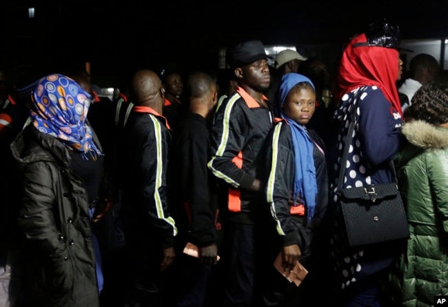 Nigerian returnees from Libya wait to be registered by officials upon arrival at the Murtala Muhammed International Airport in Lagos, Nigeria, Dec. 5, 2017.