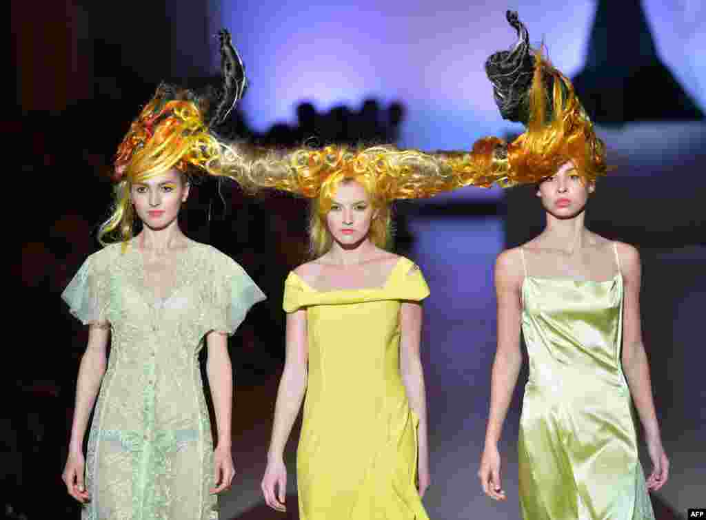 Models present a creation of Ukrainian fashion designer Aleksey Zalevskiy during the opening day of &quot;Seasons of the fashion - 2014&quot; in Kyiv, Ukraine. 