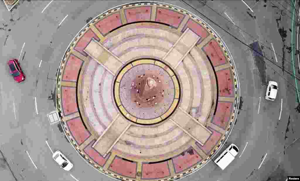 This image from above shows little traffic in a roundabout in Quezon City, during a two-week lockdown following a rise in COVID-19 cases, in Metro Manila, Philippines.