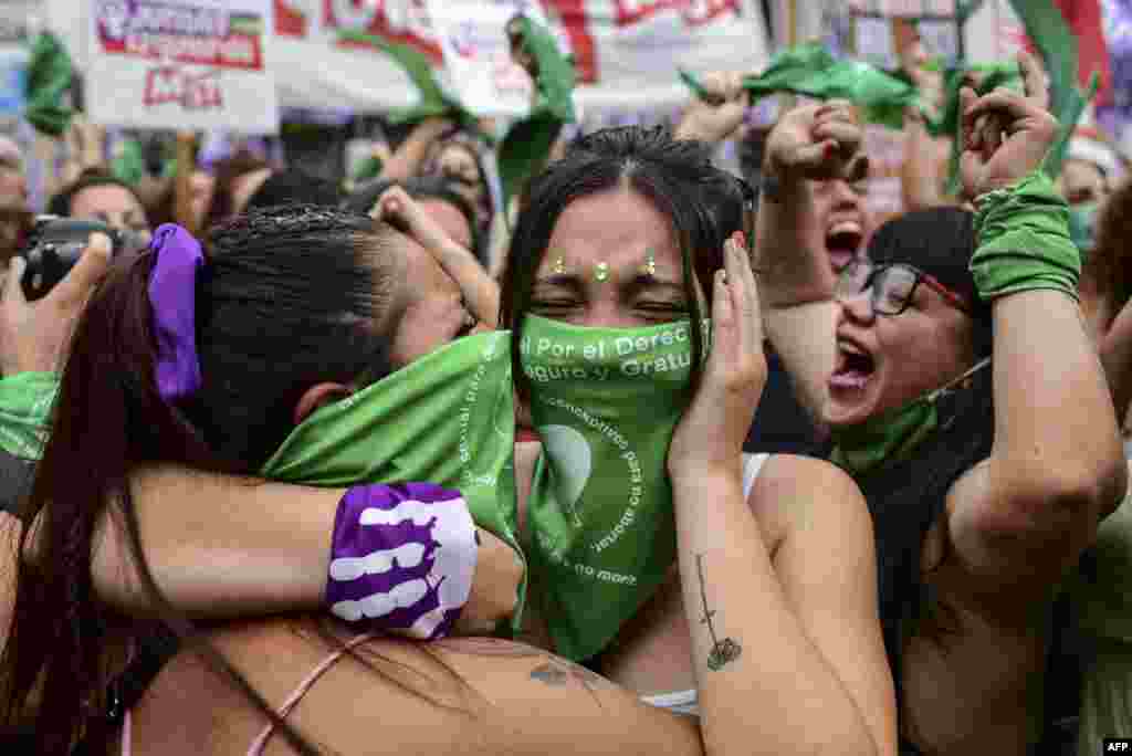 Demonstrators celebrate with green headscarves &mdash; a representation of abortion rights activists &mdash;outside the Argentine Congress in Buenos Aires, Argentina, after legislators passed a bill to legalize abortion.