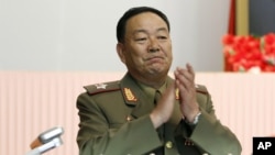 FILE - Recently executed then-Vice Marshal Hyon Yong Chol applauds during a meeting at the April 25 House of Culture announcing North Korean leader Kim Jong Un's new title of marshal.