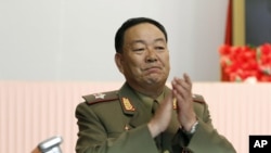 FILE - Recently executed then-Vice Marshal Hyon Yong Chol applauds during a meeting at the April 25 House of Culture announcing North Korean leader Kim Jong Un's new title of marshal.