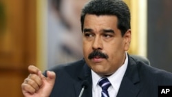 FILE - Venezuela's President Nicolas Maduro speaks during a press conference at Miraflores Presidential Palace in Caracas, Venezuela, Dec. 30, 2014.