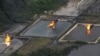 FILE - A gas flare at Shell Cawtharine Channel, Nembe Creek in the Niger Delta. 