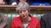 FILE - British Prime Minister Theresa May reacts after tellers announced the results of the vote Brexit deal in Parliament in London, Britain, March 12, 2019, in this screen grab taken from video.