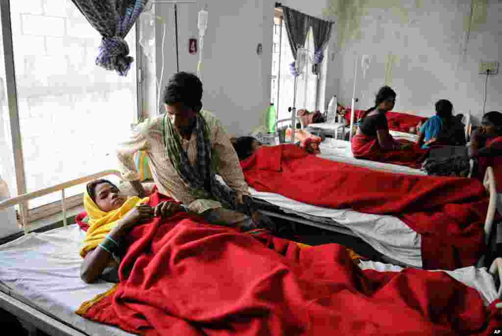 Indian women who underwent sterilization surgeries receive treatment at the District Hospital in Bilaspur, in the central Indian state of Chhattisgarh, Wednesday, Nov. 12, 2014.