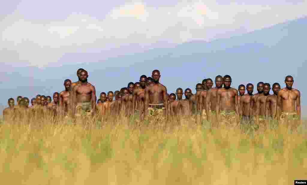 M23 rebel recruits stand at attention during a training session at the Rumangabo military camp in eastern Democratic Republic of Congo. 