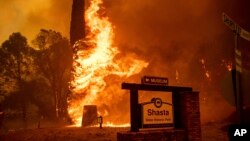The Carr Fire tears through Shasta, Calif., July 26, 2018. Fueled by high temperatures, wind and low humidity, the blaze destroyed multiple homes and at least one historic building.