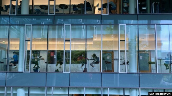 Students studying inside a building at Carnegie Mellon University.