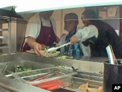 The healthful approach extends to the cafeteria at E.W. Stokes Public Charter School, where students can help themselves to the salad bar.