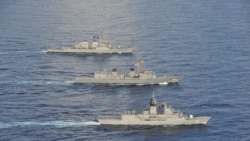 资料照片：美国第七舰队公布的照片显示，美国、日本和澳大利亚海军2020年10月19日在南中国海举行当年第五次联合演习。