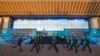 Kazakh guards march in front of the Republic Palace during the Constitution Day celebrations in Almaty, Aug. 30, 2014. 