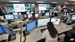 FILE - The National Cybersecurity & Communications Integration Center (NCCIC) prepares for the Cyber Storm III exercise at its operations center in Arlington, Va., Sept 2010. 