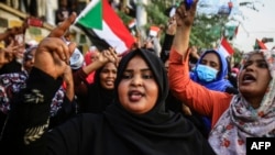 FILE - Sudanese women demonstrate in support of a civilian body to lead the transition to democracy, in Khartoum, April 12, 2019. Women say they were key forces in the Sudanese revolution and now deserve government leadership posts.