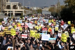 FILE - Iranian worshippers chant slogans in a rally after Friday prayer in Tehran, Iran, Dec. 8, 2017. Hundreds rallied to show their anger after the Trump administration's recognition of Jerusalem as Israel's capital.