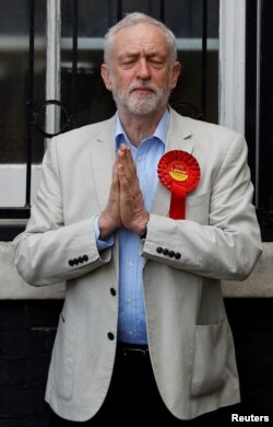 Britain's Labour Party leader Jeremy Corbyn gestures after voting in local government elections in London, May 3, 2018.