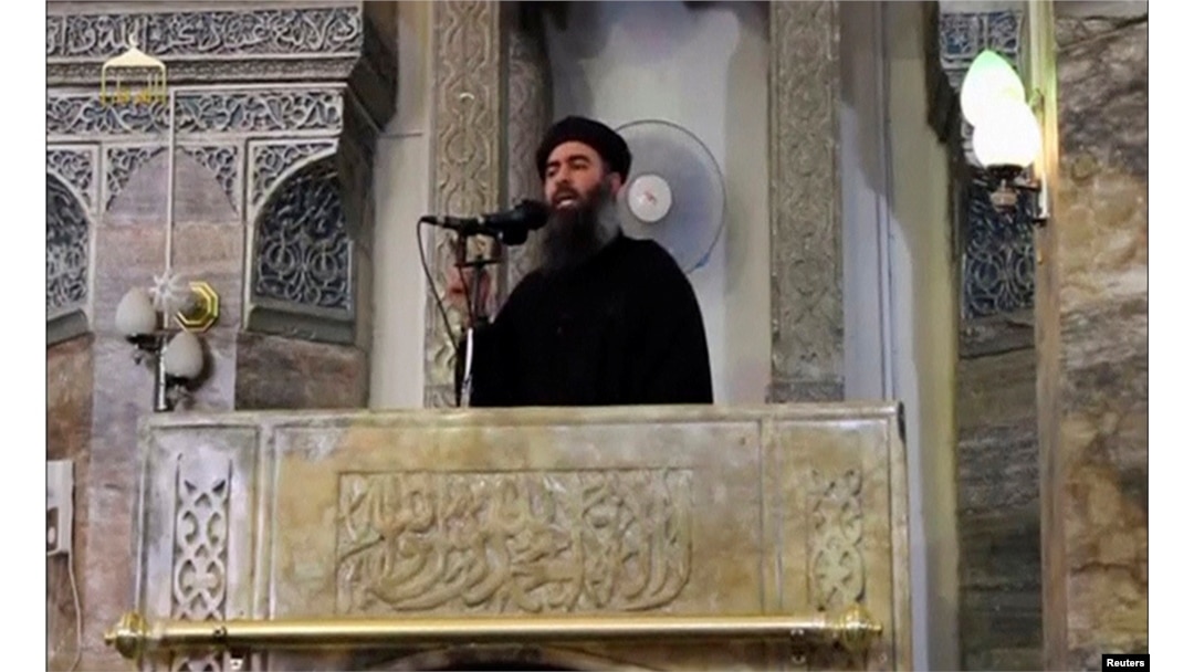 A man purported to be the reclusive leader of the militant Islamic State Abu Bakr al-Baghdadi has made what would be his first public appearance at a mosque in the centre of Iraq's second city, Mosul, according to a video recording posted on the Internet on July 5, 2014, in this still image taken from video. Social Media Website via Reuters TV/File Photo