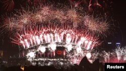 Fireworks explode over and around the Sydney Harbour Bridge and Sydney Opera House during new year celebrations in Australia, January 1, 2013.