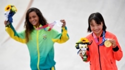 Rayssa Leal and Momiji Nishiya of Japan pose with their skateboarding medals.
