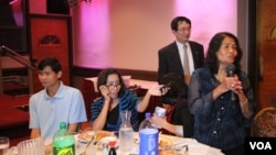 File: Marie Chea, Cambodian retiree, asks question to President of Cambodia National Rescue Party, Sam Rainsy, during a dinner gathering with Cambodians from DMV area at Harvest Moon restaurant, Virginia, on Thursday Oct 6, 2016.