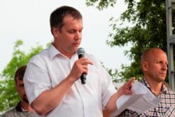 FILE - Anatoly Bokun, leader of strike committee at Belaruskali, a huge potash factory in Soligorsk, speaks to workers in Soligorsk, Belarus, Wednesday, Aug. 19, 2020.