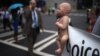 A pro-life activist holds a doll and banner while advocating his stance on abortion near the site of the Democratic National Convention in Charlotte, North Carolina on September 4, 2012. President Barack Obama will be nominated as the Democratic candidate