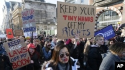 Demonstrators take part in the Women's March on London, following the Inauguration of U.S. President Donald Trump, in London, Jan. 21, 2016.