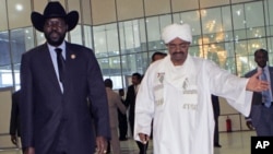 Sudan's President Omar al-Bashir welcomes his South Sudanese counterpart Salva Kiir for his first visit since southern secession to discuss key unresolved issues that have undermined north-south relations, during his arrival at Khartoum Airport, Sudan, Oc