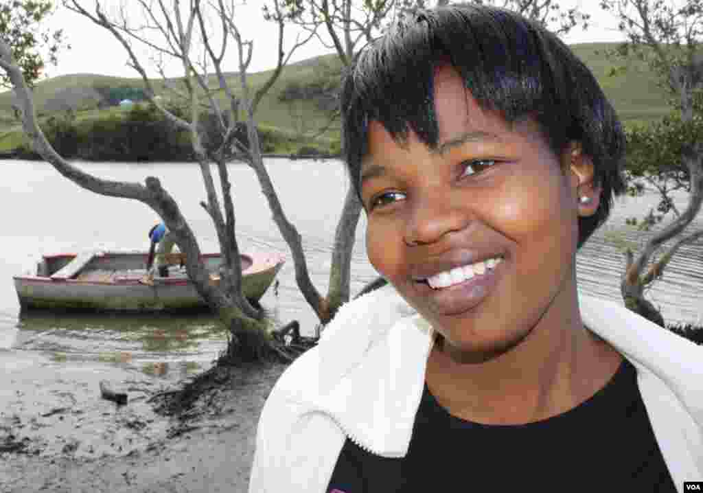 Senyuko, who cannot swim, is overjoyed after crossing the river successfully (VOA/D. Taylor)