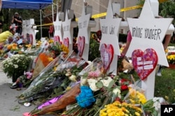 Flowers surround Stars of David, part of a makeshift memorial outside the Tree of Life synagogue in Pittsburgh, Oct. 31, 2018.