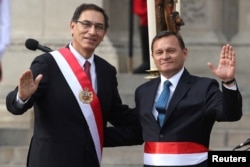 Peru's President Martin Vizcarra, left, and new Foreign Minister Nestor Popolizio pose for a picture during a swearing-in ceremony at the government palace in Lima, April 2, 2018.