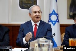 FILE - Israeli Prime Minister Benjamin Netanyahu attends the weekly cabinet meeting at his office in Jerusalem, July 8, 2018.