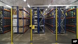 FILE - In this photo taken Oct. 18, 2015, rows of boxes containing seed samples stored inside the Global Seed Vault in Svalbard, Norway.