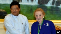 Burma's Vice President Nyan Tun shakes hands with former U.S. Secretary of State Madeleine Albright during their meeting in Naypyitaw, Burma, June 3, 2013.