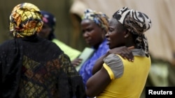 Women gather at a camp for Internally Displaced People as more women and children rescued from Sambisa arrive in the camp in Yola, Nigeria May 3, 2015.