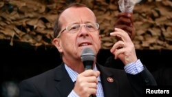 FILE - Martin Kobler, U.N. special envoy to the Democratic Republic of the Congo, addresses troops outside Goma, Aug. 31, 2013. 