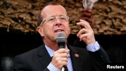 FILE - U.N. special envoy to Congo, Martin Kobler, addresses troops outside Goma in the eastern Democratic Republic of Congo, Aug. 31, 2013. 