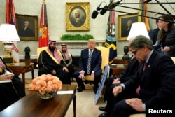 U.S. President Donald Trump, flanked by Energy Secretary Rick Perry, delivers remarks as he welcomes Saudi Arabia's Crown Prince Mohammed bin Salman in the Oval Office at the White House in Washington, March 20, 2018.