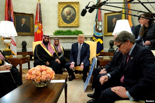 U.S. President Donald Trump, flanked by Energy Secretary Rick Perry, delivers remarks as he welcomes Saudi Arabia's Crown Prince Mohammed bin Salman in the Oval Office at the White House in Washington, March 20, 2018.