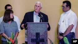 U.S. Vice President Mike Pence, center, accompanied by his wife Karen, left, speaks after a meeting with Venezuelan families at the Santa Catarina migrant shelter, in Manaus, Brazil, June 27, 2018. 