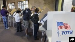 People vote early at the Salt Lake County Government Building in Salt Lake City, October 30, 2012.