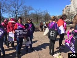 Women prepare to march in International Women's Day Protest in Washington, D.C. on March 8, 2017. (Photo: E. Sarai / VOA)