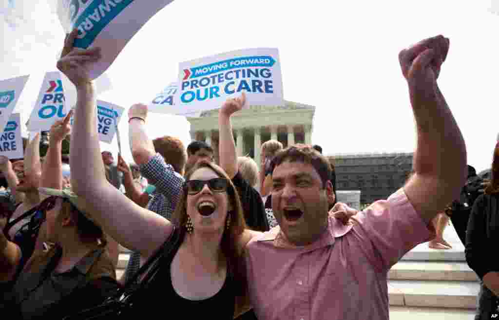 Claire McAndrew and Donny Kirsch, both of Washington, celebrate after the court&#39;s ruling.