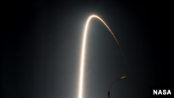 FILE - The Soyuz TMA-17M rocket launches from the Baikonur Cosmodrome in Kazakhstan, as seen in this long exposure, on July 23, 2015. 