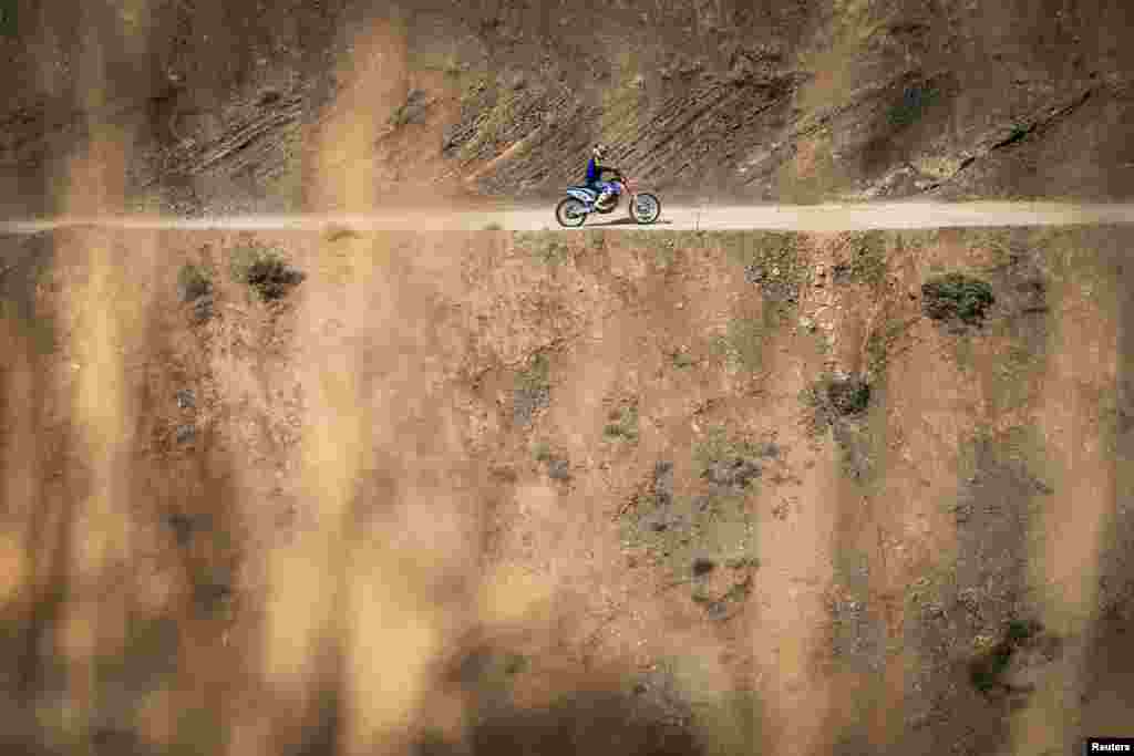 Baran Hadizadeh, a female biker, rides her motorbike outside of Tehran, Iran, Aug. 7, 2019.