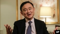 In this March 9, 2016 file photo, Thailand's former Prime Minister Thaksin Shinawatra responds to questions during a news interview in New York. (AP Photo/Frank Franklin II, File)