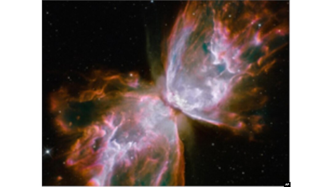 These roiling cauldrons of gas are actually a dying star that was once about five times the mass of the sun. The "butterfly" stretches for more than two million light-years.