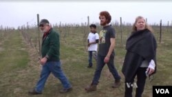 Virginia winery owner Doug Fabbioli walks with farming students at his free agriculture school.