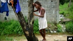 FILE - Mercy Kennedy, 9, cries after learning her mother has died of Ebola, one day after medical workers took her to a nearby hospital in Monrovia, Liberia, Oct. 2014.